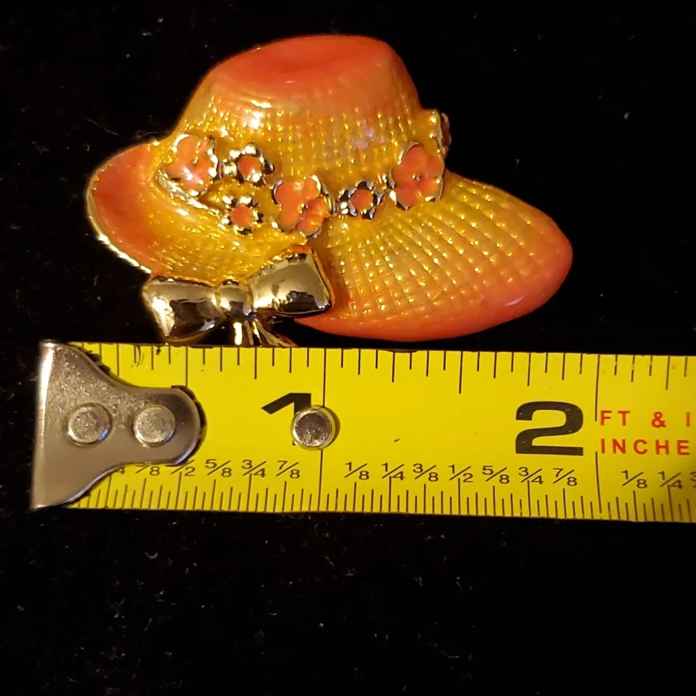 Goldtone and pink enamel hat brooch with bow and flowers